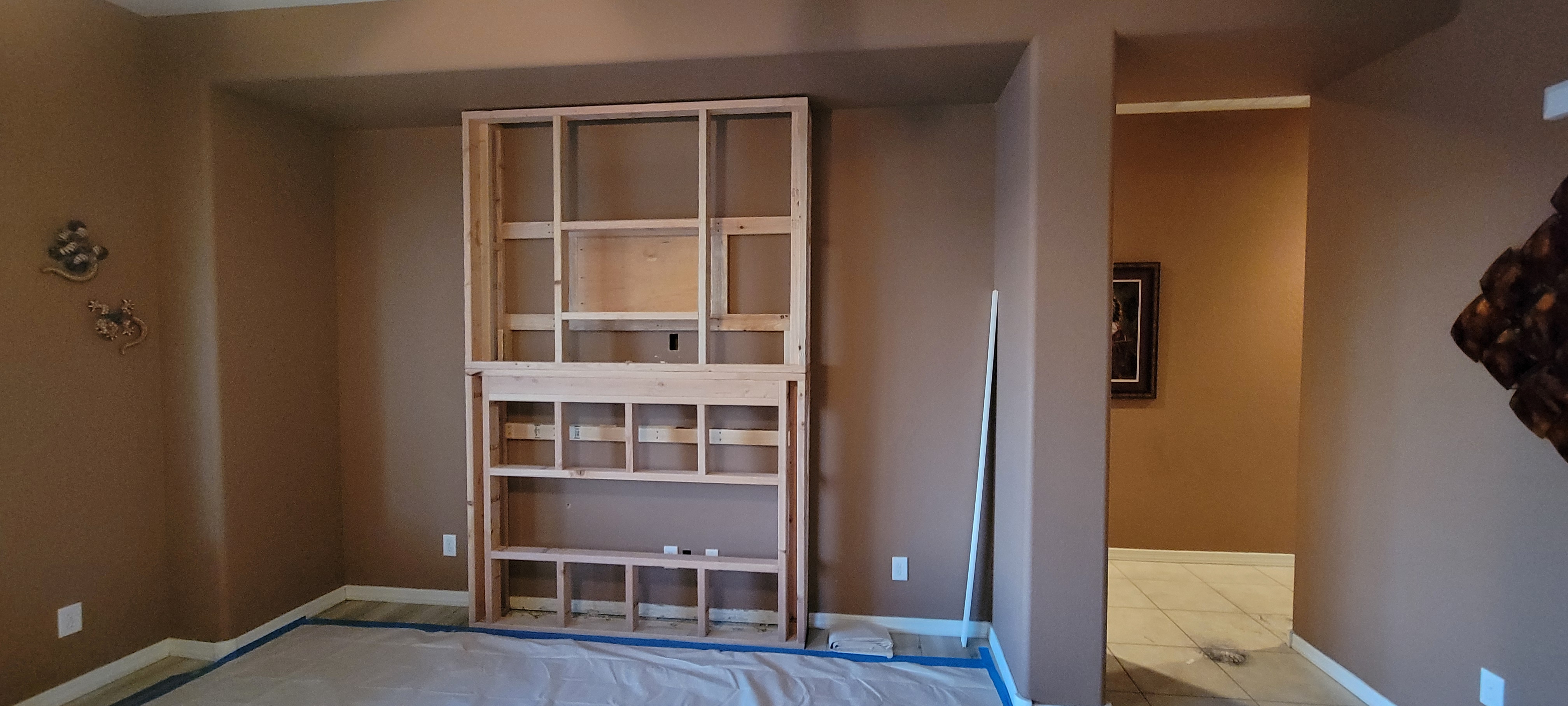 Blue tape design process - framing with layout mapped on wall